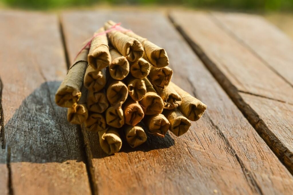 Cinnamon sticks on a wooden table.