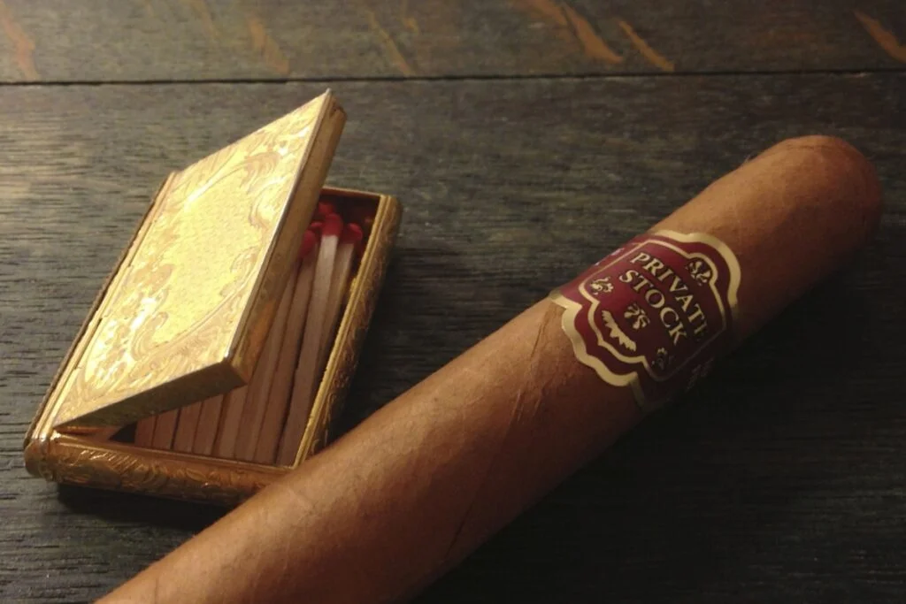 an Authentic Smoke with a box of matches next to it