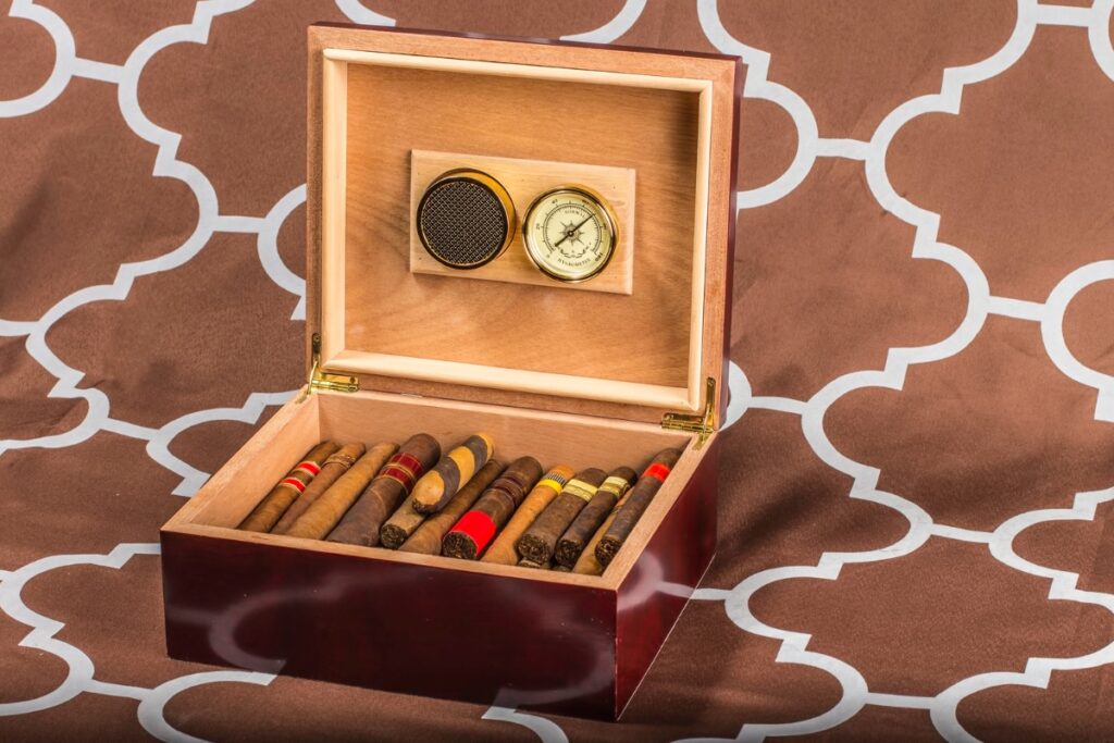 Selecting a humidor to store cigars in a wooden box with a clock.